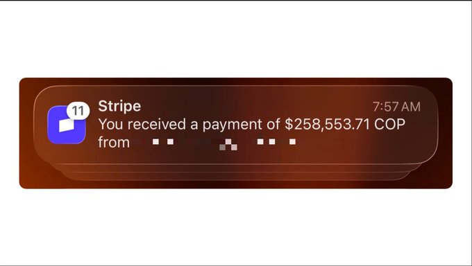 A iOS notification from Stripe at 7:57 AM shows a received payment of $258,553.71 COP, with the sender's name blurred out and a badge count of 11 unread alerts, illustrating the poster's brief shock before realizing the large sum was in Colombian Pesos (a relatively small amount in USD) rather than dollars.