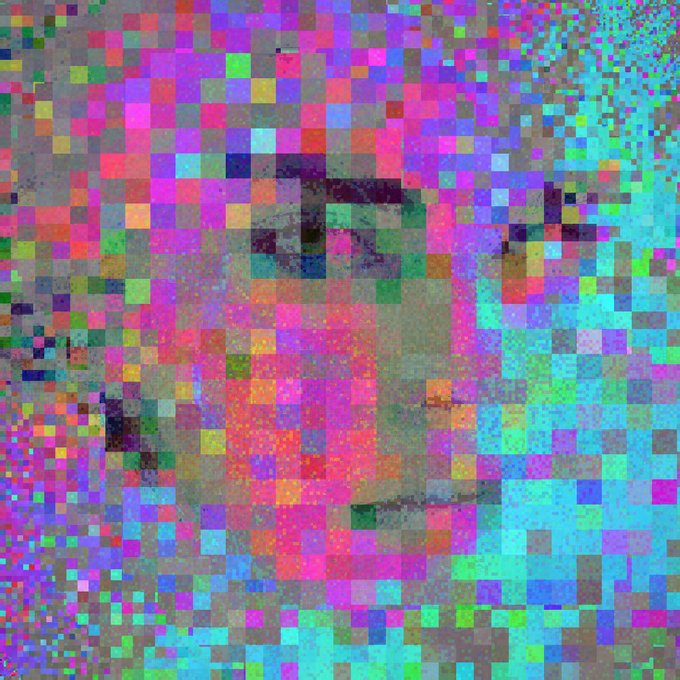 A heavily pixelated, glitch-art style image of a face with vibrant colors.