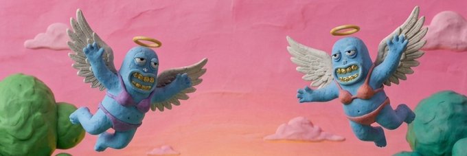 Two blue claymation-style winged monsters with golden halos and toothy grins fly across a pink sky, capturing the playful and original aesthetic that the post highlights about the @just_t00ns NFT project.