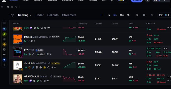 A trading platform interface showing trending tokens including MSTRx ($60M), FLY ($6.25K), JubJub ($1.11M), and GRANDMAJII ($6.9K) with various market metrics.