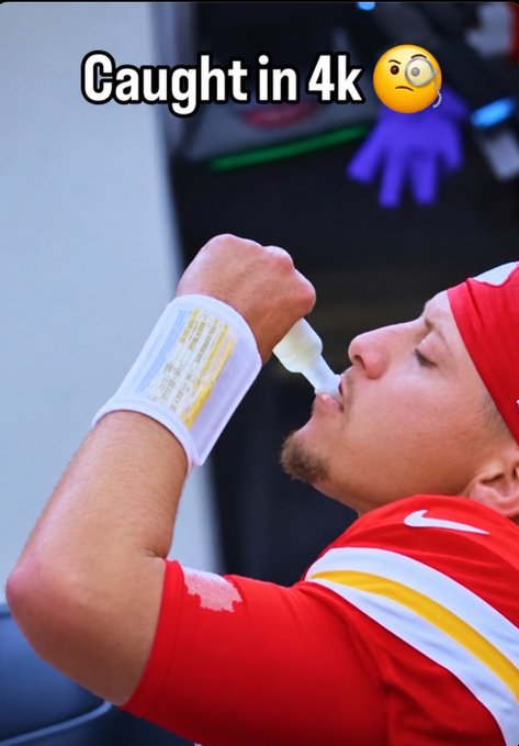 A Kansas City Chiefs player in a red jersey uses a nasal inhaler on the sideline, with the caption 'Caught in 4k' and a monocle emoji overlaid.