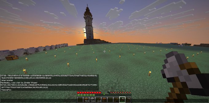 A first-person view from the video game Minecraft showing a grassy plain at sunset with a lighthouse in the distance and a held axe in the right hand.