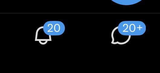 A dark screen showing two blue message notification badges, one reading '20' on a bell icon and the other reading '20+' on a speech bubble icon.