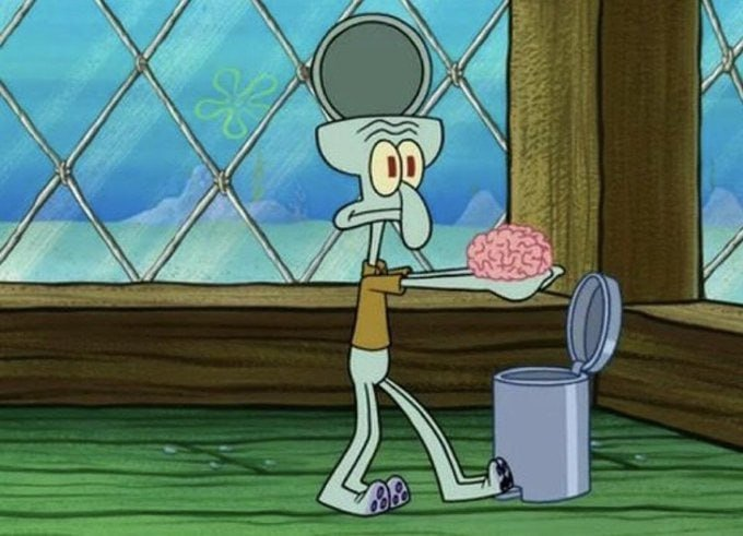 Squidward from SpongeBob SquarePants is holding a tray with a pink brain on it, standing next to an open trash can with his eyes wide and a strained expression.