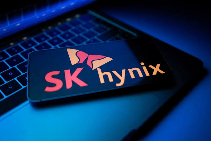 A smartphone displaying the SK Hynix logo rests on a laptop keyboard, visually representing the chip giant whose stock has been newly tokenized and made accessible through Telegram's integrated Wallet feature via xStocks.