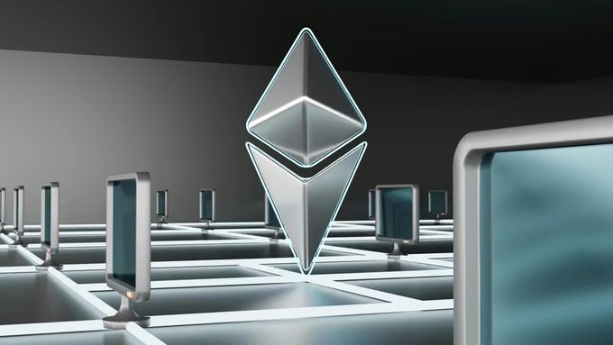 A futuristic 3D rendering of the Ethereum (ETH) logo as a glowing crystalline diamond shape, floating above a grid of metallic structures with blue screens in a dark, sci-fi environment.