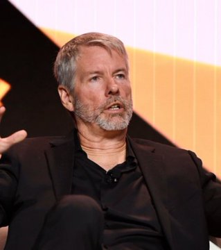 Michael Saylor, the executive chairman of Strategy (formerly MicroStrategy), speaks at an event while news reports that his company has sold 1,690 BTC worth approximately $108.6 million at an average price of $64,262 per coin.