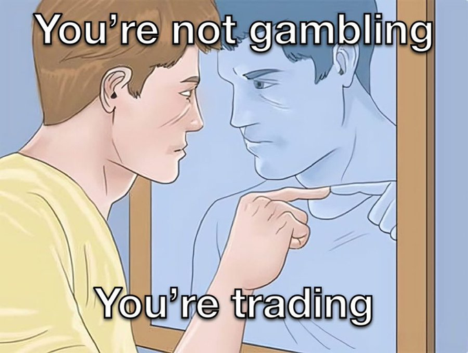 The image shows a young man pointing at his reflection in a mirror, with the text "You're not gambling, You're trading" displayed in bold white letters. The mirror metaphor relates to the post's message about persistent effort leading to success—suggesting that what may appear to be "luck" or random chance is actually the result of disciplined, deliberate work and searching, transforming risk into strategic exchange with oneself.