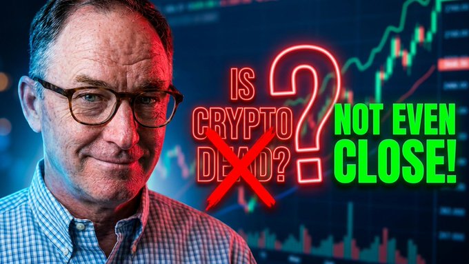 "The XRP TRAP! Death of Crypto vs. The Clarity Act (Includes P)". This video features a man wearing glasses, possibly a businessman or market analyst, posing against an abstract background of cryptocurrency prices for the XRP token. There are two questions posed above his head and below him in red letters that ask: "Is Crypto Even Crypto?" and "Not even close!". The overall tone is humorous and satirical as it mocks the notion that Bitcoin or any other form of cryptocurrency can be considered "even" when they're all essentially digital money.