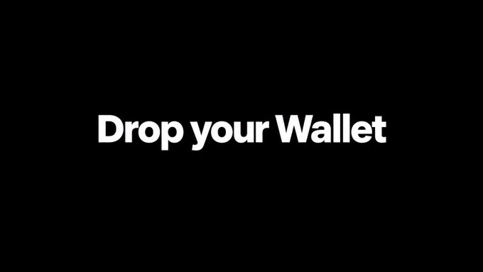 The image features bold white text on a black background that reads "Drop your Wallet," which directly echoes the post's call to action asking users to share their EVM wallet addresses in the comments.