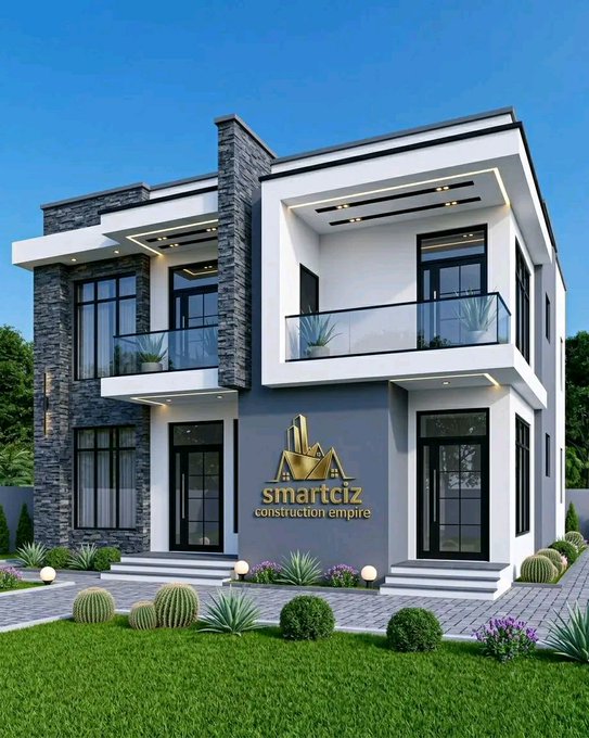 A modern two-story house with stone and white exterior finishes, featuring a 'smartciz construction empire' logo with a city skyline graphic.