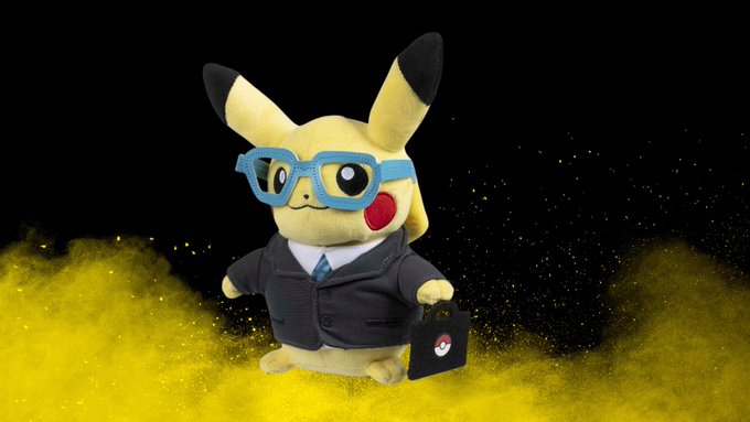 A Pikachu plush dressed in a gray business suit, blue glasses, and a tie, holding a briefcase with a Poké Ball emblem, poses against a dramatic black background with yellow powder clouds—presenting a "corporate mascot" vibe that humorously represents the account's "CEO."