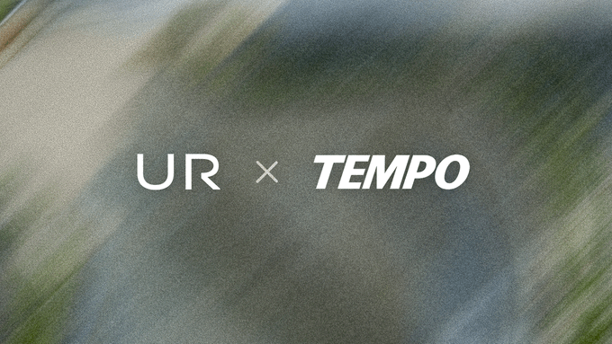 The image features the logos "UR" and "TEMPO" separated by a multiplication symbol, set against a softly blurred, natural-toned background. It visually represents a partnership between UR and Tempo, aligning with the announcement about integrating multi-currency accounts, Swiss IBANs, and card issuance for platforms building on Tempo.