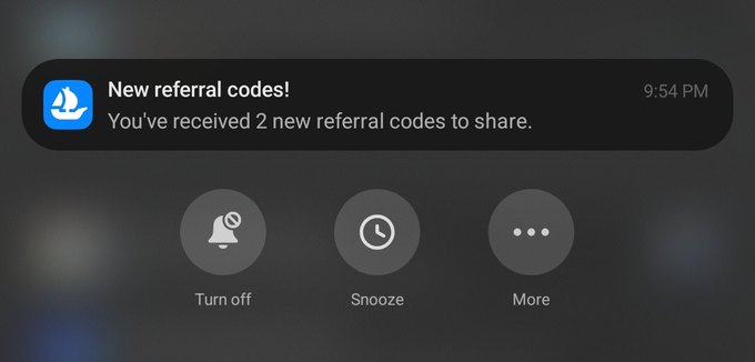 A notification from OpenSea reads "New referral codes! You've received 2 new referral codes to share," sent at 9:54 PM, visually confirming the poster's claim of having 2 OpenSea invitation codes available to share with others.