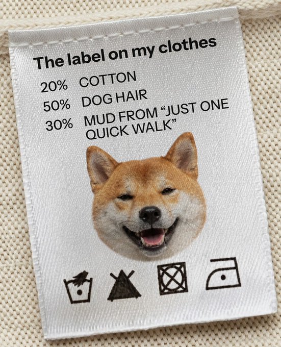 A clothing label humorously reads "The label on my clothes" with a breakdown of 20% Cotton, 50% Dog Hair, and 30% Mud from "Just One Quick Walk," featuring a smiling Shiba Inu and care instruction icons. The label cleverly personifies the post about "Baby Dogers" (likely a misspelling of Doges), suggesting these dogs' wardrobes would consist mostly of dog hair and mud.