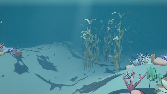 An underwater 3D rendered scene features a sandy seabed, kelp, coral, and sunlight filtering down through the blue water.