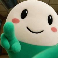 A cute mascot plushie with a big smile gives a peace sign, humorously mirroring the celebratory, victorious mood of scoring a massive gain on a memecoin after a long "trenching" journey.