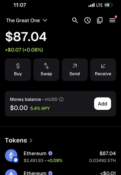 A cryptocurrency wallet app displays an account labeled "The Great One" with a balance of $87.04, showing a small gain of +$0.07 (+0.08%), holding 0.03492 ETH valued at $2,491.93 per Ethereum. The modest balance reflects the poster's journey "from scraping wallets" to finally seeing some financial progress, capturing their excitement at finally getting paid in crypto.