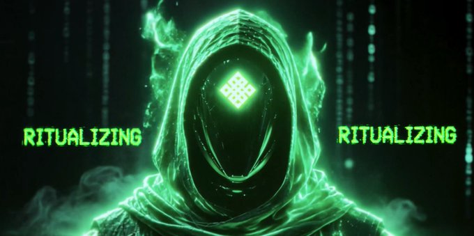 A green hooded figure with a digital diamond face is flanked by the word 'RITUALIZING' on both sides against a background of code.