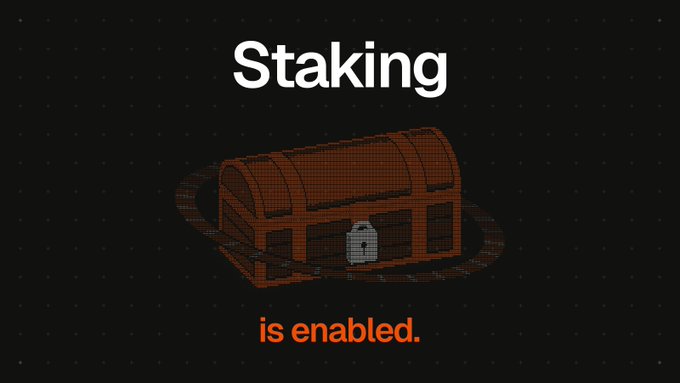 A dark image featuring the text "Staking is enabled." displayed around a pixel-art treasure chest with a lock, visually reinforcing the announcement that $LOCAL staking is now active for API usage discounts and usage dividends.