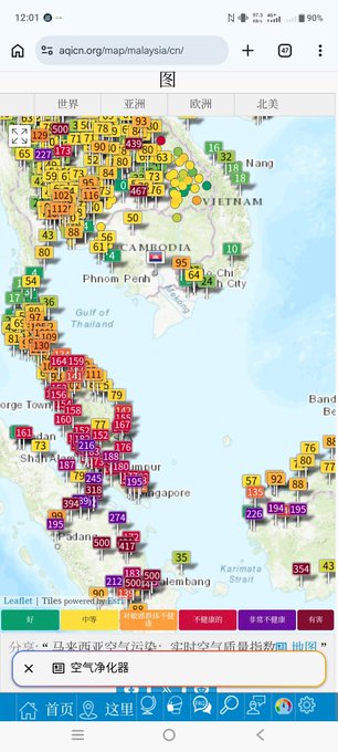 A mobile browser screenshot of an air quality index (AQI) map for Malaysia and surrounding regions on aqicn.org, showing numerous colored data points indicating pollution levels.