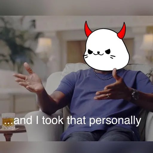 A person sitting in a chair with a devil cat sticker covering their face, gesturing with both hands, with the caption '...and I took that personally.'