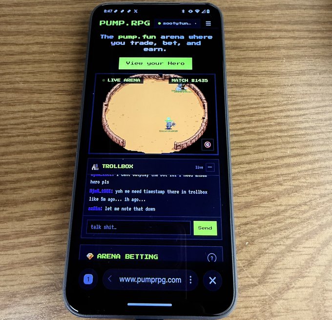 A smartphone displaying the website 'www.pumprpg.com', showing a retro pixel-art game interface for 'PUMP. RPG' with a 'LIVE ARENA' battle taking place and a trollbox chat below.