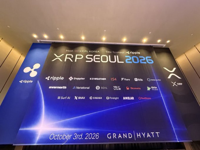 A large blue event banner for 'XRP SEOUL 2026' hosted by XRPL KOREA and title sponsored by Ripple, scheduled for October 3rd, 2026 at the Grand Hyatt, displaying numerous crypto-related sponsor logos.