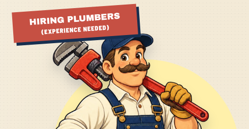 A cartoon illustration of a smiling plumber wearing blue overalls and a cap, holding a large red pipe wrench, with a banner reading 'HIRING PLUMBERS (EXPERIENCE NEEDED)'.