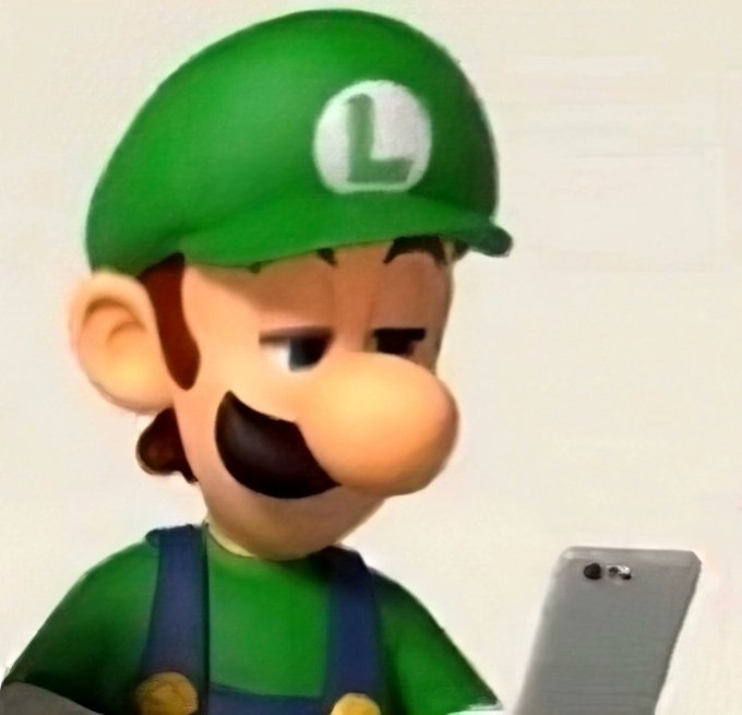 Luigi, with his iconic green cap bearing the "L" emblem, looks down at his phone with a skeptical, unimpressed expression, perfectly capturing the relatable feeling of seeing a group mention notification that turned out to be unrelated or anticlimactic.