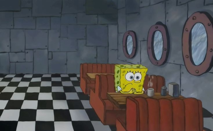 SpongeBob SquarePants sits alone at a booth in the Krusty Krab, looking sad and dejected with a mug of steaming coffee, illustrating the somber mood of investors after a broad market downturn across stocks, crypto, and commodities—with only oil managing a gain.