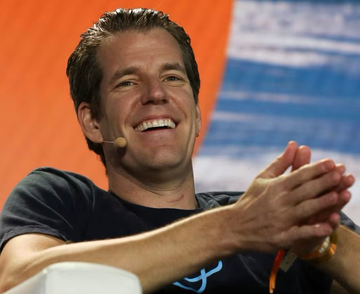 A smiling Tyler Winklevoss, co-founder of Gemini, discusses Bitcoin's scarcity and value. His statement suggests that price drops are an opportunity to acquire more Bitcoin.