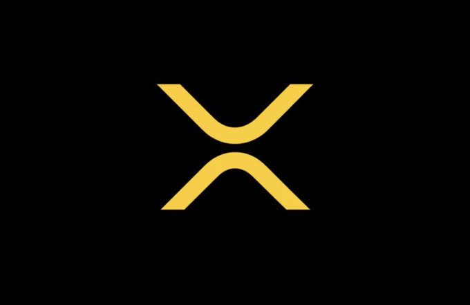 The image features a striking logo with an X shape, which is yellow in color. The X appears to be crossed out by a line or a shadow, giving it a unique appearance. The background of the image is black, providing a strong contrast that makes the yellow X stand out even more. The text "XRPCommunity" is written below the logo, indicating its connection to the XRPC community.