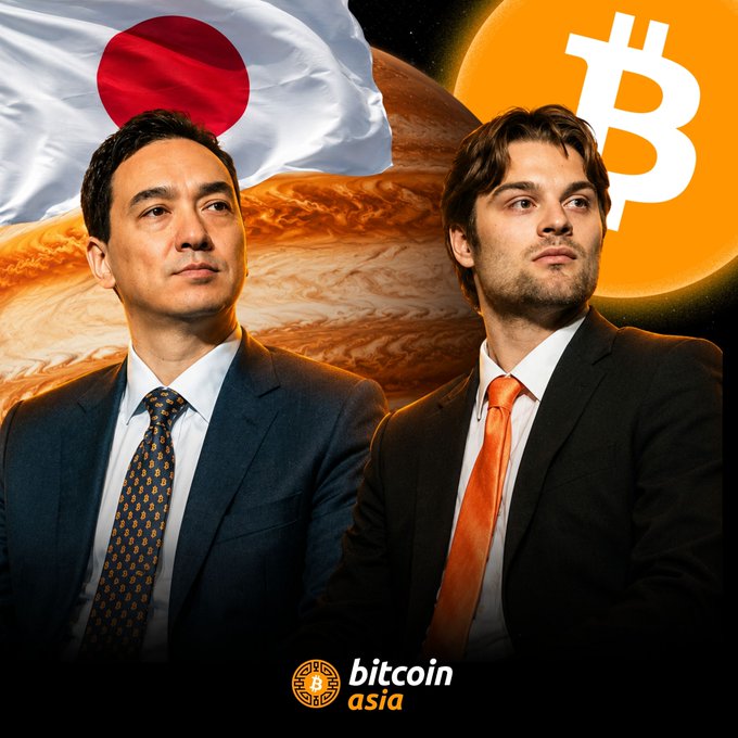 Two men in suits appear against a cosmic backdrop featuring the Japanese flag and a Bitcoin symbol, with the "bitcoin asia" logo displayed at the bottom. The image visually reinforces the news of Metaplanet's strategic Bitcoin investment in SUPERPLANET, highlighting the Japanese-Jupiter connection in the company's expansion into the U.S. market.