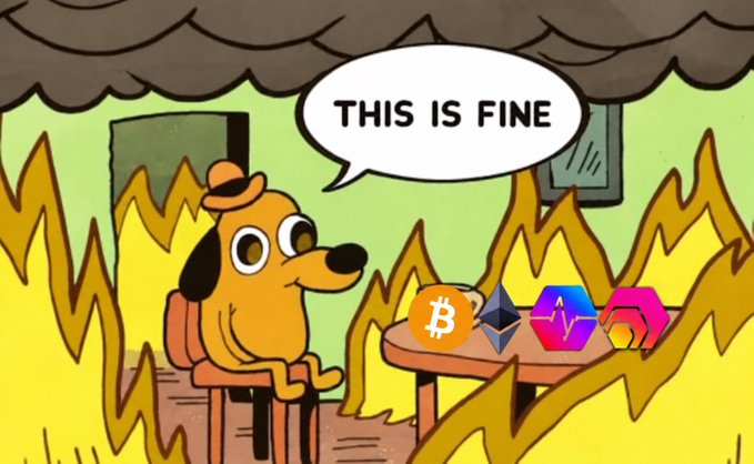 The 'This is fine' meme featuring a dog sitting in a burning room saying 'THIS IS FINE', with crypto logos (BTC, ETH, SOL, and another token) placed on the table.