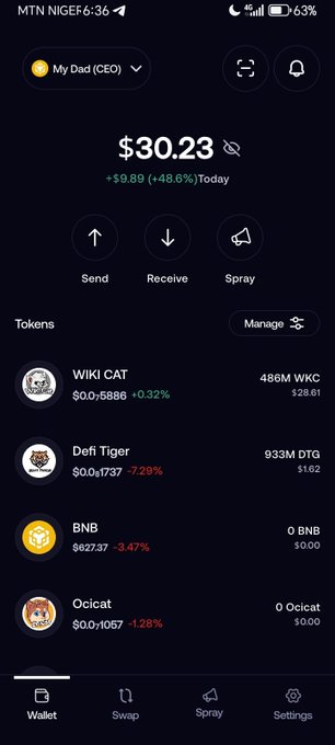 The image shows a phone screen displaying various cryptocurrency transactions and their respective values. The most prominent transaction is $30,23, representing a trading activity involving coins known as WKCC or Wallet Coin Contracts, while other transactions show different types of digital assets such as tigers, cats, and dragon coins. The cell phone also features an icon that reads "My dad" below the wallet balance. The post's message suggests users should be cautious about their Bitcoin transactions due to a fluctuating value and mentions holding at least 600 million remaining or 1 billion dollars worth of WKCC in cryptocurrency.