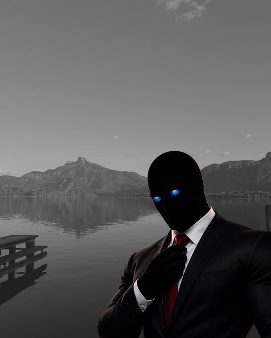 A shadowy figure in a black suit with striking blue eyes stands before a serene lake and mountain backdrop. The mysterious, enigmatic image complements a $15 giveaway post, evoking a sense of intrigue around the promotional event.