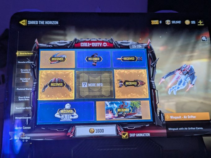 A tablet screen displaying a Call of Duty Mobile 'Shred the Horizon' battle pass rewards screen with multiple 'RECEIVED' items, a Wingsuit Air Drifter reward preview, a '1600' CP price button, and a 'Skip Animation' checkbox.
