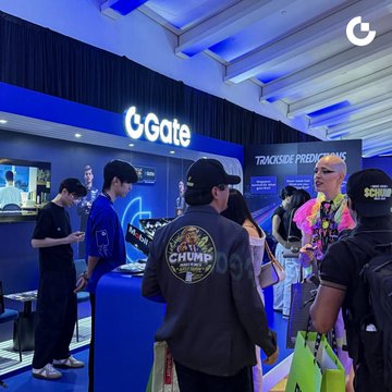 Attendees gather at the CGate booth during a TRACKSIDE PREMIUMS event, with several people wearing merchandise including a 'CHUMP' jacket and interacting with staff at the brightly lit display.