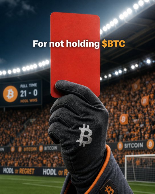 A gloved hand brandishing a Bitcoin logo raises a red card that reads "For not holding $BTC" at a stadium displaying a scoreboard of "21-0 HODL WINS" alongside "HODL or REGRET" banners, visually reinforcing the post's referee's ruling against those who failed to hold their Bitcoin.
