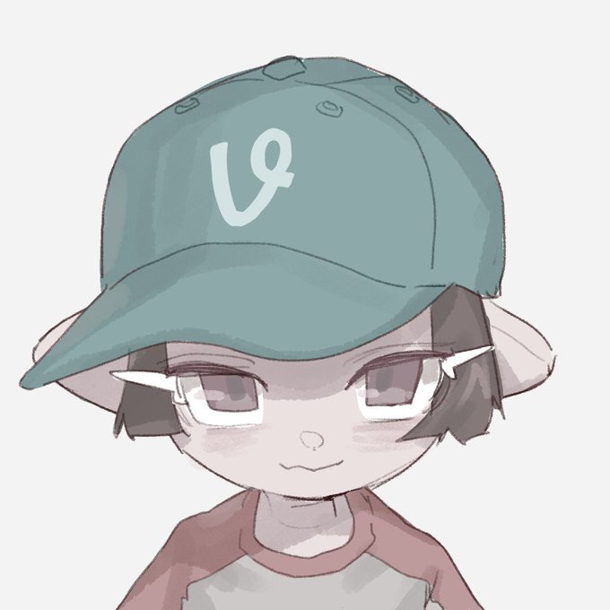 An illustration of a small, elf-like anime character with pointy ears, glasses, and a green baseball cap featuring a stylized 'L' logo.