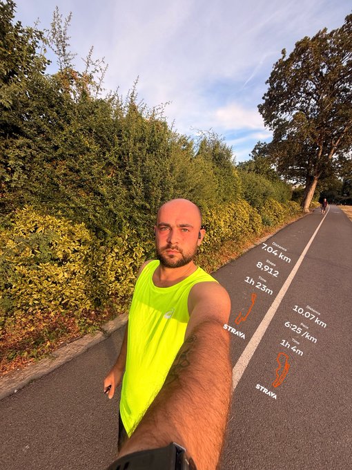 A bald man with a beard wearing a neon yellow tank top takes a selfie on a paved road, with overlaid text showing Strava run statistics: '7.04 km', '8,912', '1h 23m', '10.07 km', '6:25/km', and '1h 4m'.