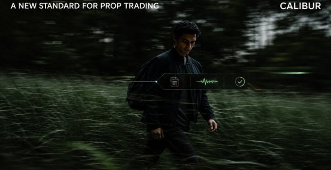 A promotional advertisement for CALIBUR prop trading, featuring the text 'A NEW STANDARD FOR PROP TRADING' and showing a man in black walking through tall grass with audio waveform and UI elements overlaid.