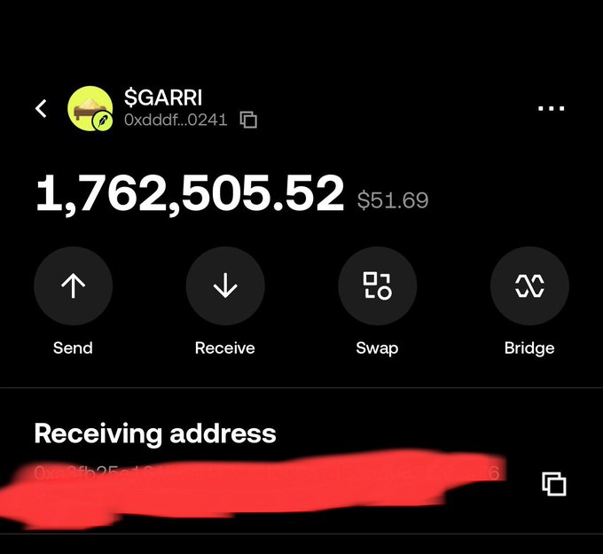 Screenshot of a cryptocurrency wallet interface showing a $GARRI token balance of 1,762,505.52 (worth $51.69) with a receiving address partially redacted for privacy.