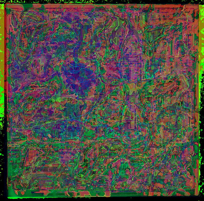 An abstract, heavily textured image featuring chaotic swirls of green, purple, pink, and orange colors that create a distorted, almost glitch-art visual effect.