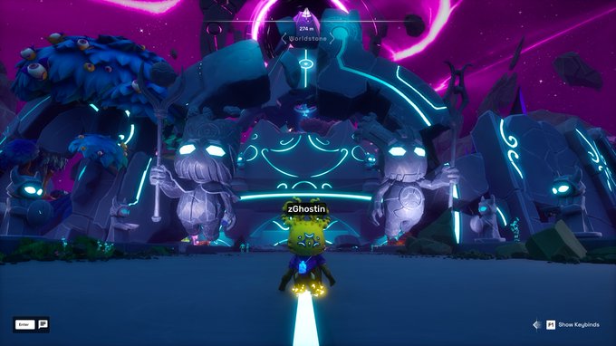 A player named "zGhostin" stands before an ornate, glowing temple flanked by giant stone statues in the OthersideMeta game, with on-screen text reading "BridgeStone" and "274 m." The image showcases a user's customized Koda character, which appears as a small creature with glowing blue eyes, standing in front of the impressive mystical architecture as highlighted in the post celebrating the character's appearance.