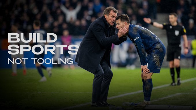 A coach (resembling Marco Silva) intensely embraces a muddy player on the sidelines, with overlaid text reading "BUILD SPORTS, NOT TOOLING."

**Connection to the post:** The image's message—that building sports experiences shouldn't require new custom foundations—mirrors the post's point that sports developers building on-chain shouldn't have to learn a "new development universe." Just as the coach supports his player to keep playing the game they already know, sports builders should be able to rely on familiar Solidity, EVM-style RPCs, Ethers.js, Hardhat, and Foundry tools rather than reinventing tooling infrastructure.