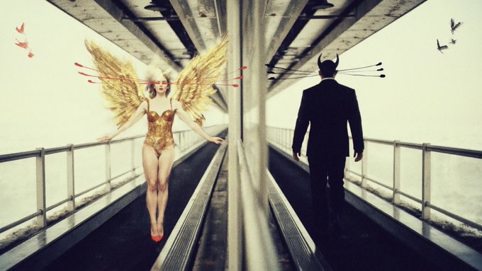 A surreal artistic image showing an angel in a gold corset with golden wings facing a suited devil with arrows through his head, both on parallel walkways with birds flying in the background.