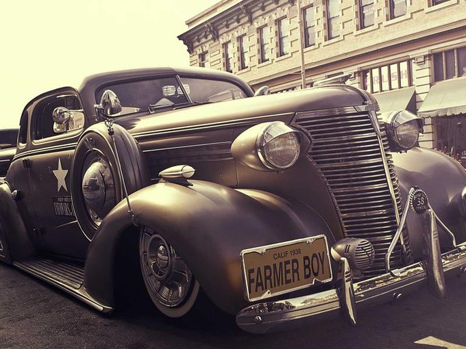 A classic vintage car with a California license plate reading "FARMER BOY" is parked on a city street, featuring a white star emblem on its side. The image's "Good Morning" (GM) energy aligns with the motivational post, as the polished, well-maintained classic vehicle symbolizes dedication, hard work, and the rewarding results of effort over time—much like the message about future self-appreciation for today's work.
