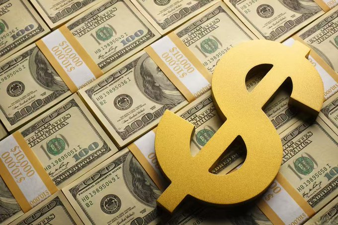 Stacks of $100 bills bound by currency straps, each labeled '$10,000', covered with a large golden dollar sign.